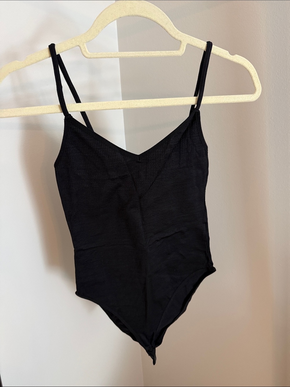 Black Ribbed One-Piece Bodysuit